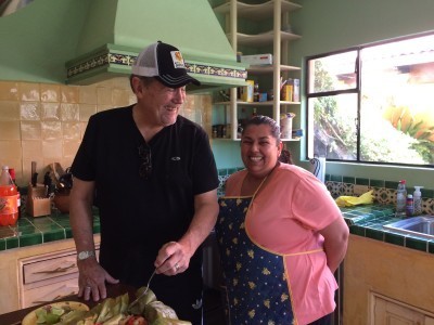 Tim and Judith Sosa, our terrific housekeeper taste her fish and veggies wrapped in banana leaves. Divine!