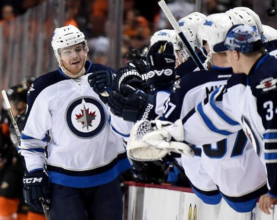 Adam Lowry celebrates his first playoff goal. 