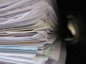 tall stack of files and documents