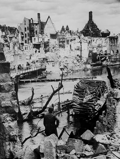 An American soldier observed the destruction of an industrial town near Nürnberg, Germany, 20 Apr 1945 (US National Archives)