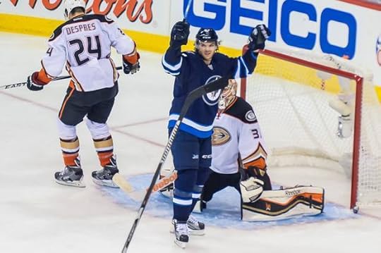Michael Frolik celebrates Tyler Myers' goal (Photo by Jeff Miller).