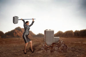 Businesswoman with sledgehammer