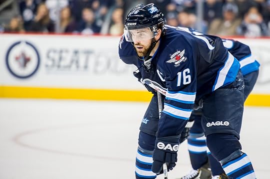 Captain Andrew Ladd played hurt. (Photo by Jeff Miller).