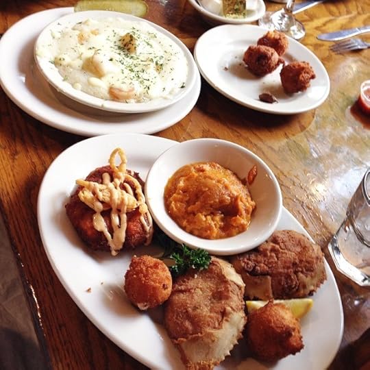 Dinner is... Salmon croquette, deviled crab, sweet potato soufflé, and Carolina shrimp and grits. I love it all!