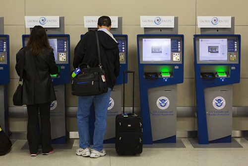 Using the Global Entry kiosks. Photos courtesy of GOES.