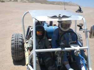 Uncle Cecil driving a car he made from scratch. His dune racers were so much fun!