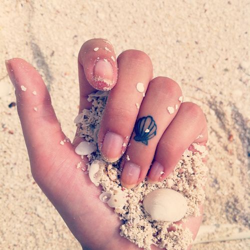 I'm not sure if I have enough balls to ever get a huge piece on me, but I really want a mermaid tattoo for sentimental reasons. This shell is so cute.