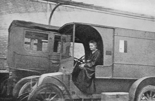 Marie Curie driving a little Curie