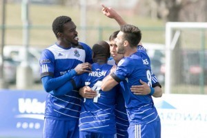 Tomi Ameobi, left, celebrates with his FCE teammates.