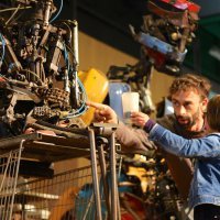 Kolja Kugler invites a young visitor to the faire up on stage to hand his robot Sir Elton Junk a glass of water between sets.