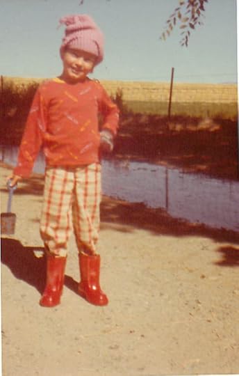 Me, out irrigating (the driveway) I've got my boot and my shovel. Ready to work! Not sure if the water was actual irrigation run-off or from watering the trees.