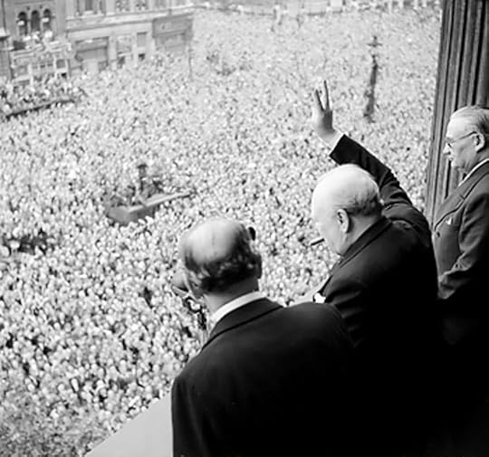 Churchill waving to crowds at Whitehall, London, on the day the war with Germany was won, 8 May 1945. (Imperial War Museum)