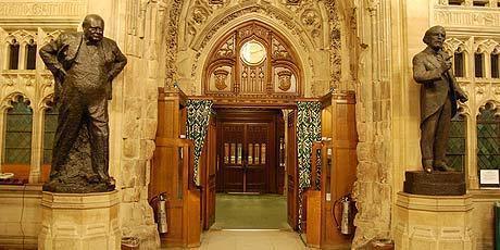 The statues of David Lloyd George and Winston Churchill in the Houses of Parliament.