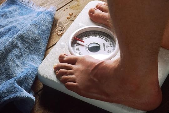 Feet on scale by Bill Branson, National Cancer Institute. Public domain via Wikimedia Commons.