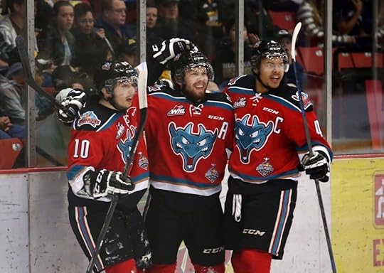 Kelowna captain Madison Bowey (R) and the Rockets celebrate the winning goal (Photo by Bruce Fedyck)