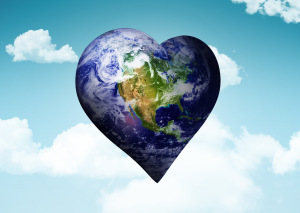 Composite image of heart shaped earth