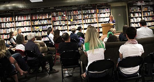 Silvia Acevedo reading a passage of God Awful Loser