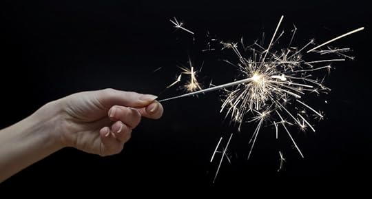 woman's hand holding a sparkler