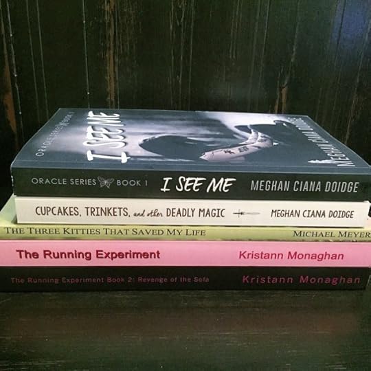 What are those I spy with my little eye? MY books!!!!!! On Colleen's giveaway photo!!