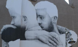 Art work of two men embracing each other