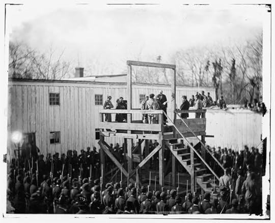 Alexander Gardner captured a series of images of Henry Wirz's execution in Washington D.c. on 10th November 1865. Here the Death Warrant is being read to Wirz on the Scaffold (Library of Congress)