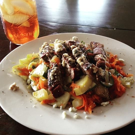 Steak over grilled vegetables