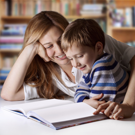 Mother reading Bible stories to her boy