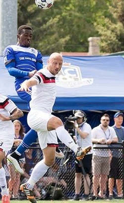 FCE's Tomi Ameobi in action against Atlanta's Simon Mensing.