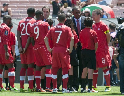 From 2013: CONCACAF President Jeffrey Webb meets with CSA President Victor Montagliani and the national men's team.