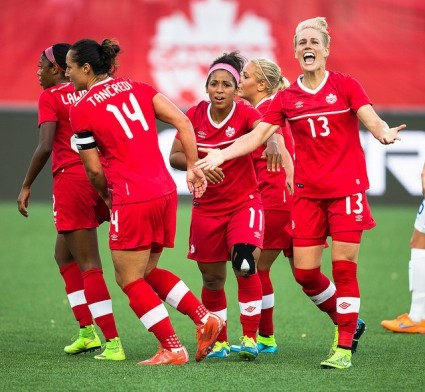 Sophie Schmidt (13) accepts congratulations from her teammates. PHOTO: PAUL GIAMOU/CANADA SOCCER
