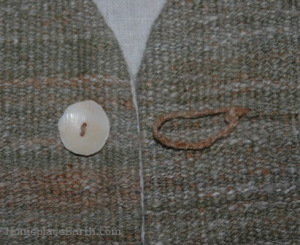Button made from a shell on the homegrown, handspun cotton vest.