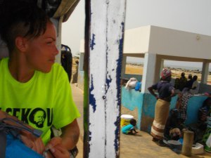 Tiel looking out van window