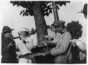 Sylvia Coney, a canteen worker from New York, serves doughnuts on the Italian front. 1917 or 1918. Prints and Photographs Division.