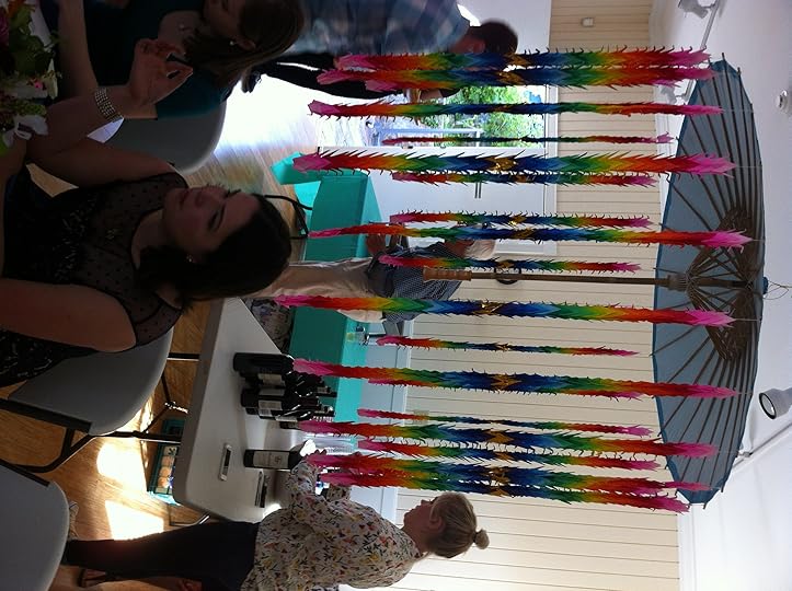 My niece sitting beneath the umbrella adorned with 1,000 paper cranes at her wedding rehearsal dinner.