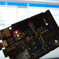 The Esquilo board in front of the onboard web-based development environment.