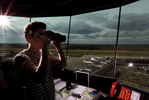 EDINBURGH, UNITED KINGDOM - APRIL 19: Greig Reid an air traffic controller looks from the air traffic control tower at Edinburgh Airport as flights are cancelled for a fifth day on April 19, 2010 in Edinburgh, Scotland. Thousand of holiday makers remain stranded abroad as the ban on flight to and from UK airport because of volcanic dust continues. (Photo by Jeff J Mitchell/Getty Images)