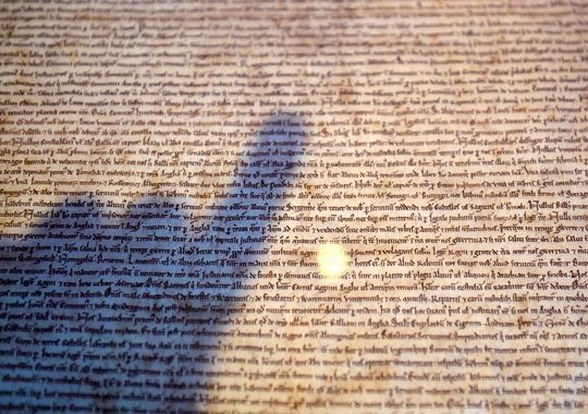 A library employee points at the Salisbury Magna Carta