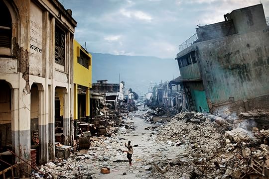 STORY: The January 12 earthquake in Haiti had catastrophic consequences, as it struck the most populated area in the country. The number of casualties rapidly rose to more than 200,000 people, and at least one million Haitians lost their homes. Structures of all kinds collapsed, from shantytowns to national landmarks. A year after the disaster the majority still lives in primitive tent camps around the city. In the weeks following the disaster sporadic violence, looting and gang-related gunfire broke out in downtown Port-au-Prince. The earthquake in Haiti could hardly have struck a worse place on the planet - the most basic necessities like water, food, electricity, communications, transportation and health care that is needed after a quake, were already inadequate before the quake hit. It has created a massive humanitarian crisis in the country routinely referred to as the poorest in the Western hemisphere. THIS IMAGE: A young boy escapes the violence that grew amid desperate looters, as gang-related gunfire broke out in downtown Port-au-Prince.