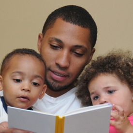 Father Reading to Children