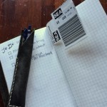 This little DIY bookmark was inspired by Patrick Ng's post at Scription. It's made from a luggage tag, and seemed appropriate for a