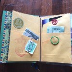 I made this little multi-pocket thing myself out of a 6x9 envelope. You can see the Midori rubber band that holds it into the notebook.