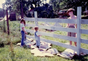 travis betsy and luke painting the fence - BLOG