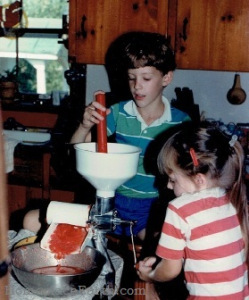 travis and betsy juicing tomatoes -BLOG