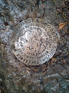 The survey marker at the top of the mountain