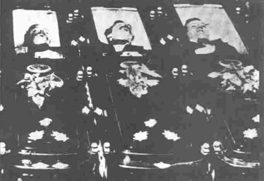 The Mclaurys and Billy Clanton in their coffins. Billy at right.