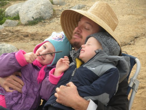 Daddy and kids at fishing lake last winter.