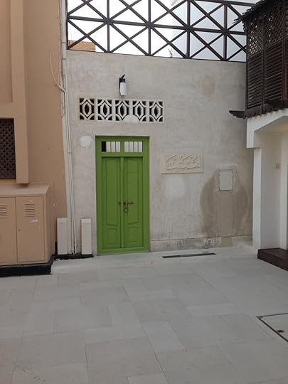 I know you're looking at that green door. But notice, too, the restored woodwork on the second story to the right.