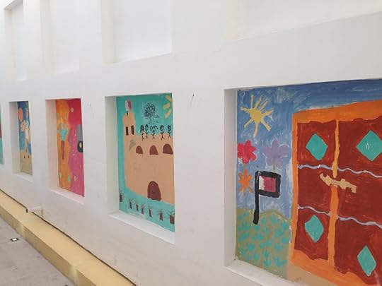 Murals (like this large-scale children's project) brightened up several walls that would otherwise have been stark white.