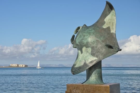 Manta copper statue by the sea