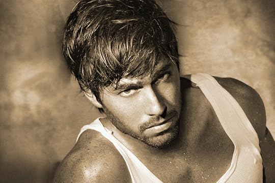 Vintage stylized monochrome sepia classic portrait of young male model (Photo has an intentional film grain)
